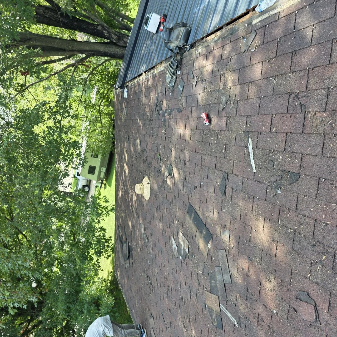 Close inspection view of worn asphalt shingles before a roofing recommendation