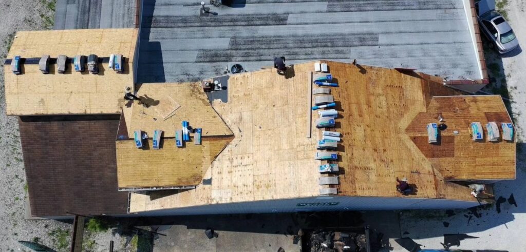 Roof damage from storm debris on home in St. Louis