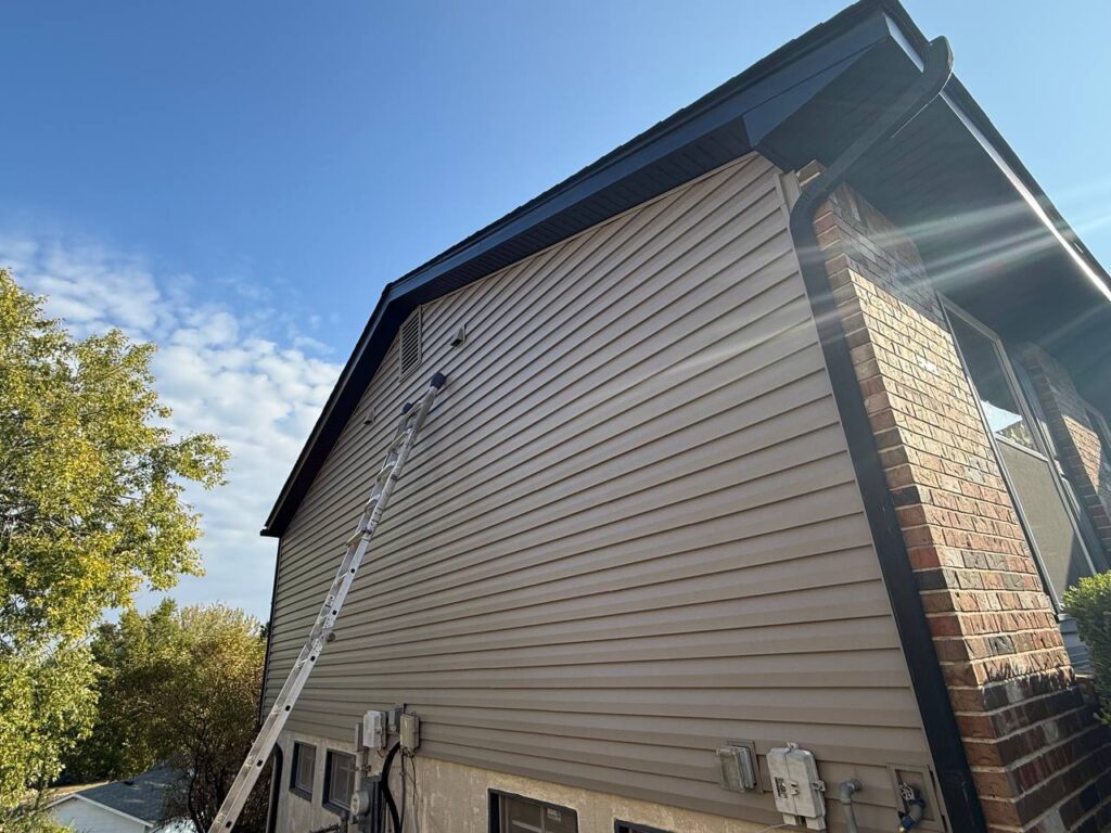 Vinyl siding installation on a St. Louis home by Gray Summit Roofing